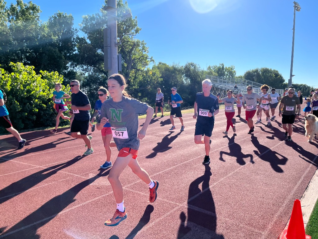 Runners taking off at the start line of the St. Vrain 5K